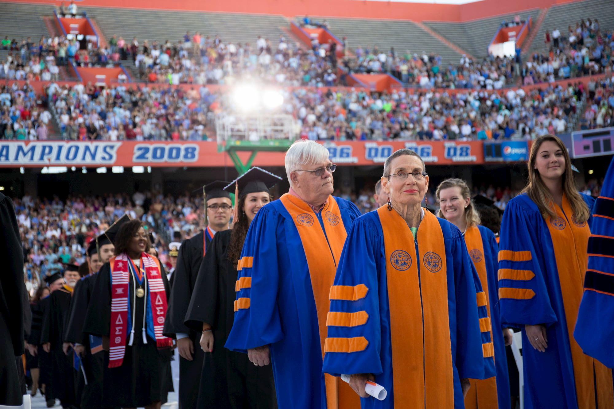 Staff and faculty in graduation regalia